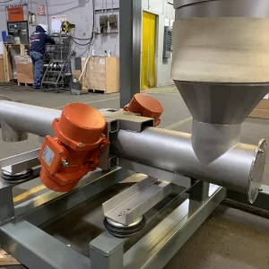 FormPak FeedFlo vibratory tube feeder inside a warehouse